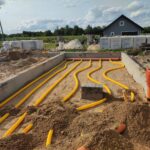 Gruntowy wymiennik ciepła z rur kanalizacyjnych w fundamencie – realizacja